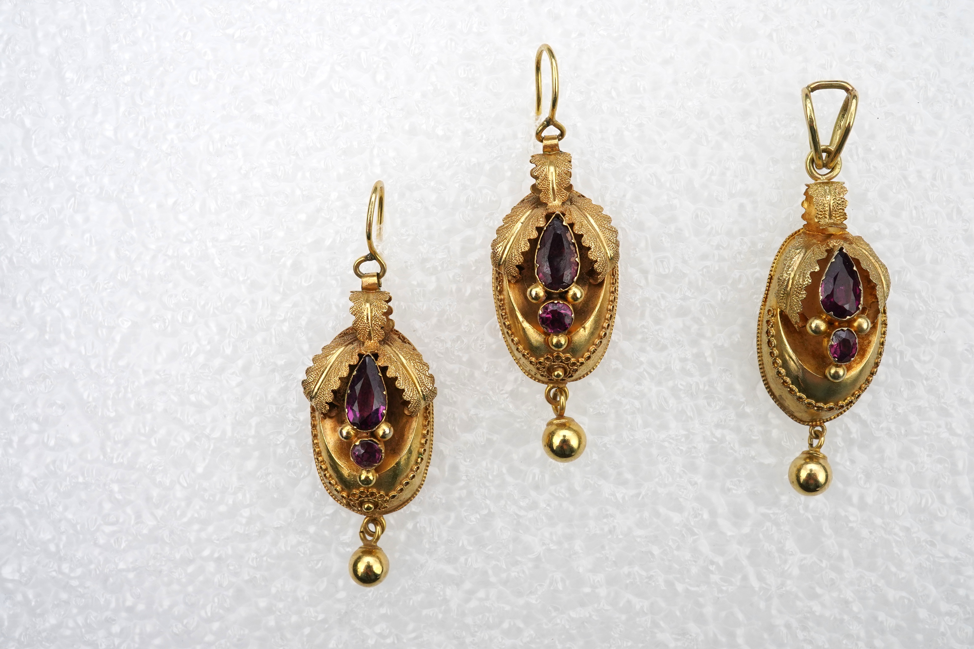 A Victorian gold and garnet demi-parure, mid 19th century